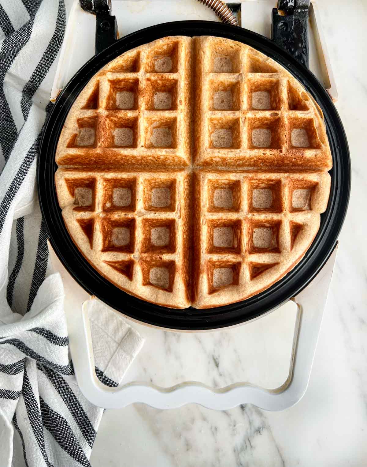 finished wheat yeast waffle in waffle iron