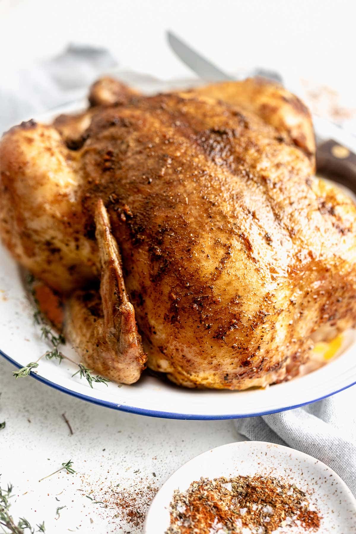 the roast chicken from the side on a platter