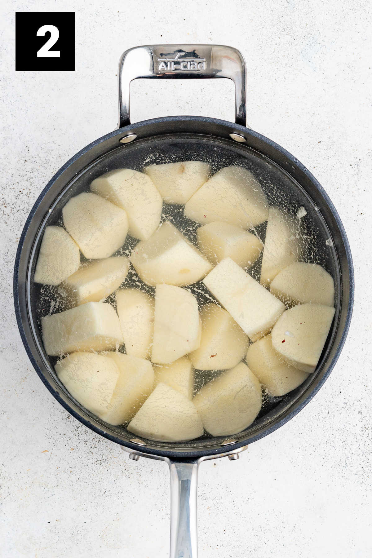 boil potatoes in a pot of water
