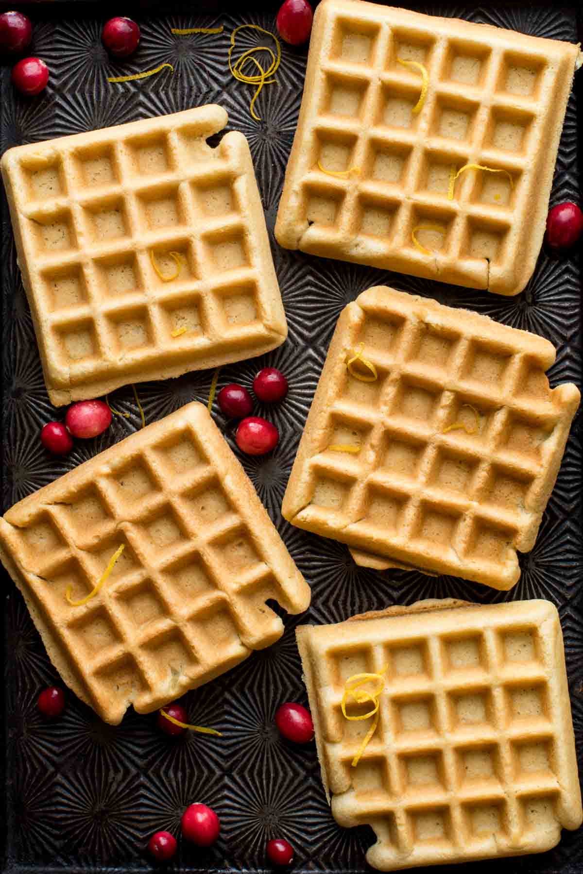 the almond waffles on a textured baking sheet