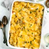 overhead shot of creamy ground turkey pasta bake in white rectangular dish