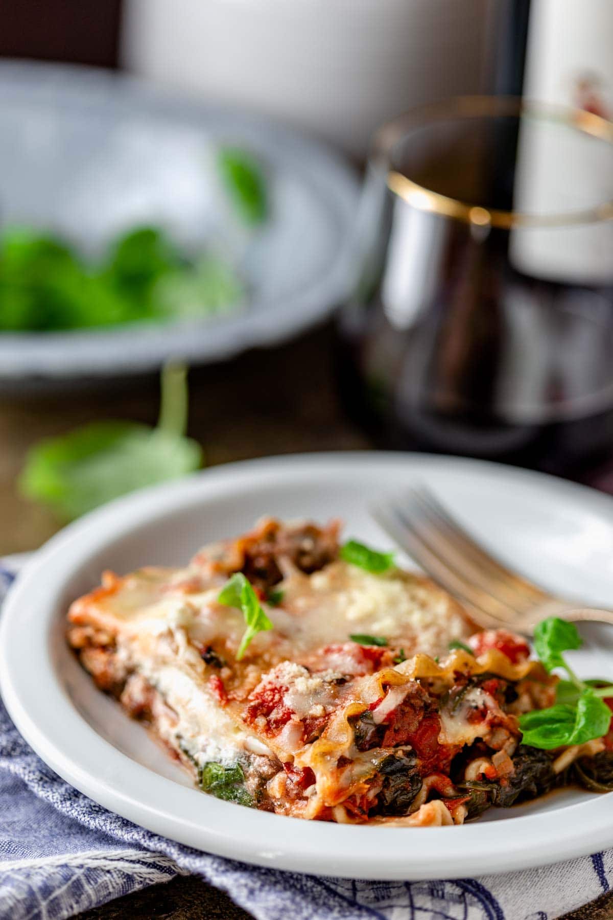 a slice of the lasagna on a white plate