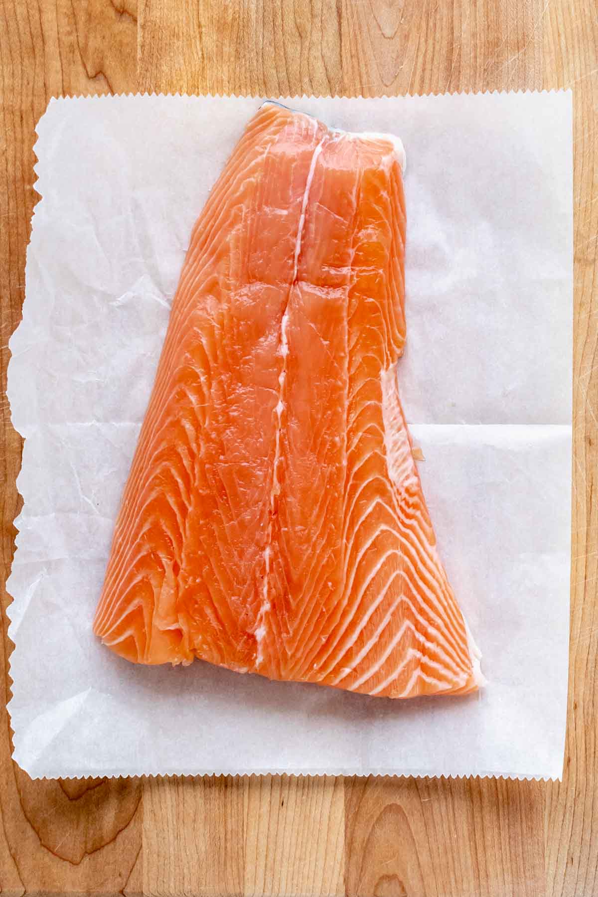 the salmon on a piece of parchment