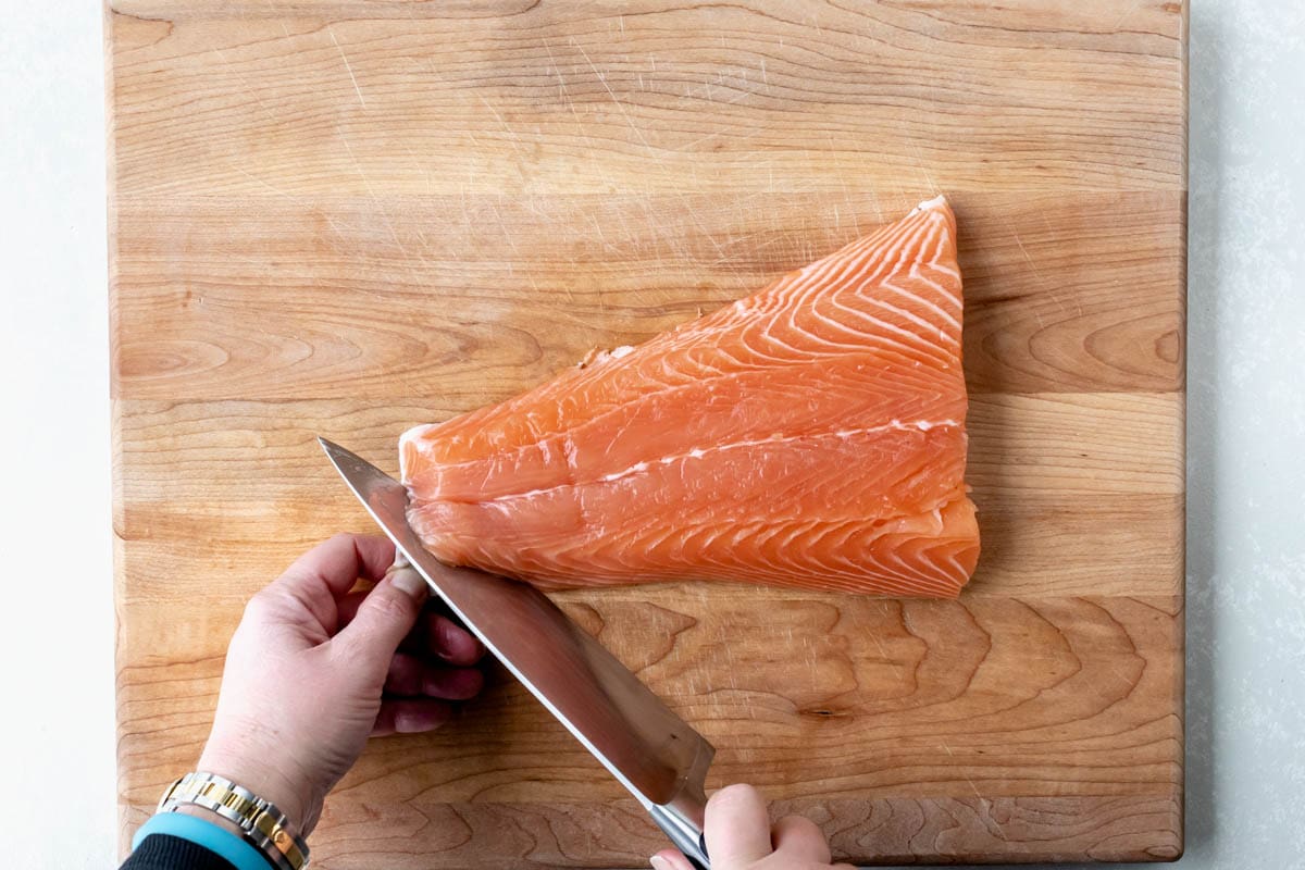 to remove skin on salmon first start by cutting to the skin