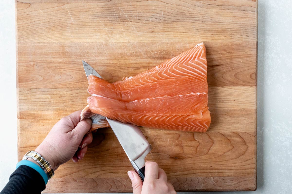 pull the skin away from the knife with your left hand