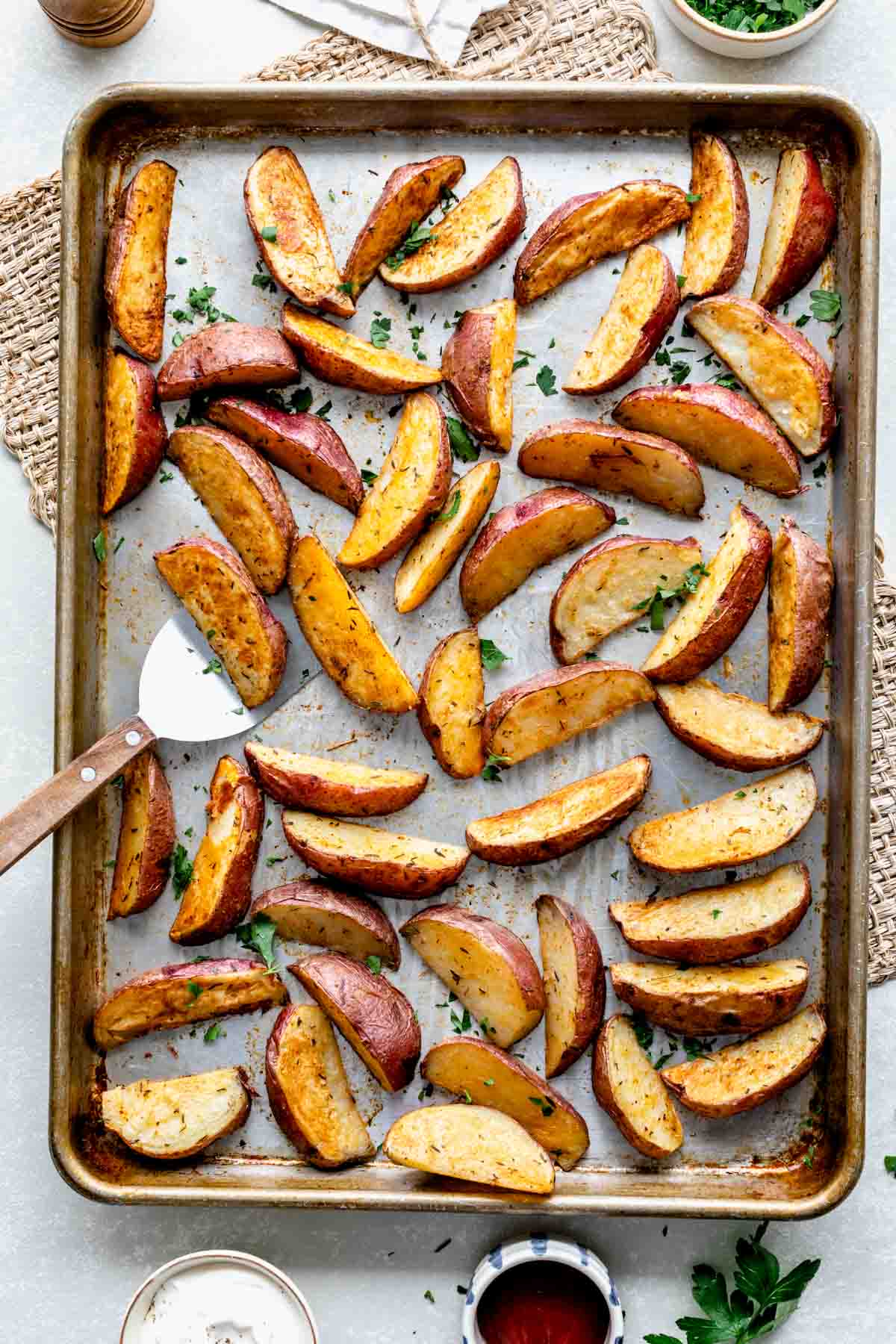 roasted red potato wedges on baking sheet