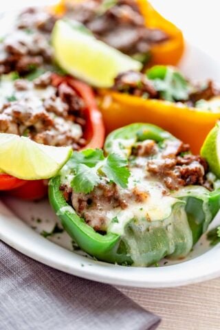 close up of low carb mexican stuffed peppers on a white plate