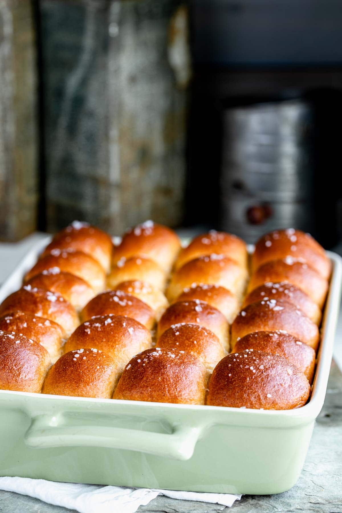 a baking dish full of whole wheat dinner rolls