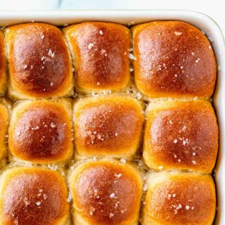 whole wheat dinner rolls browned on top and sprinkled with coarse kosher salt
