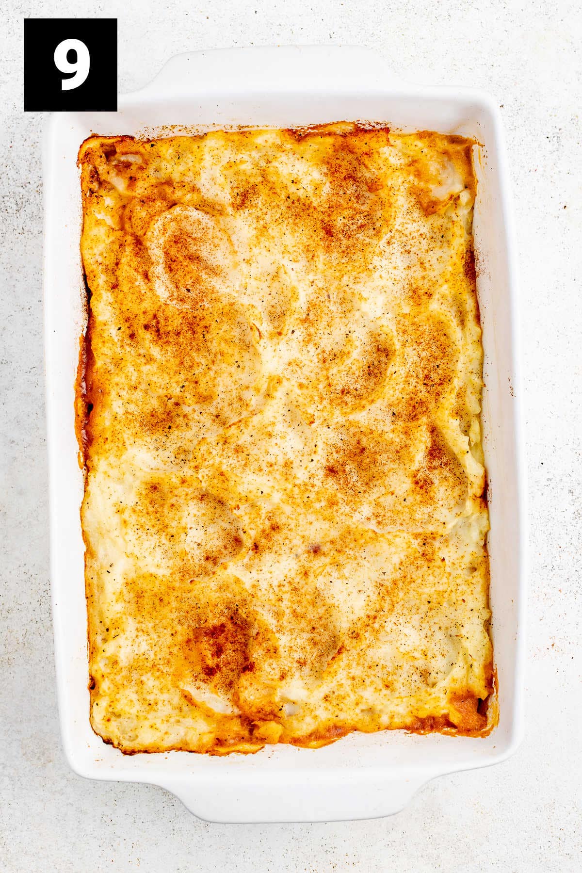 browned mashed potato crust on top of the ground turkey and vegetable shepherd's pie mixture