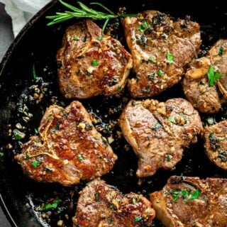 garlic herb lamb loin chops in skillet