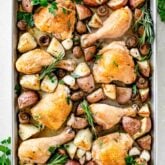 roasted chicken and potatoes on baking sheet
