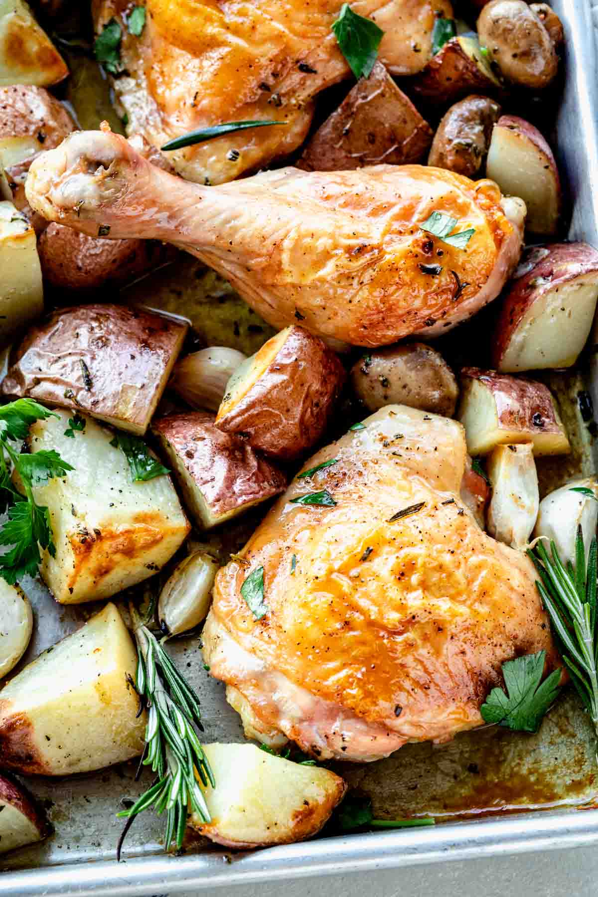 close up of one pan chicken thighs and potatoes