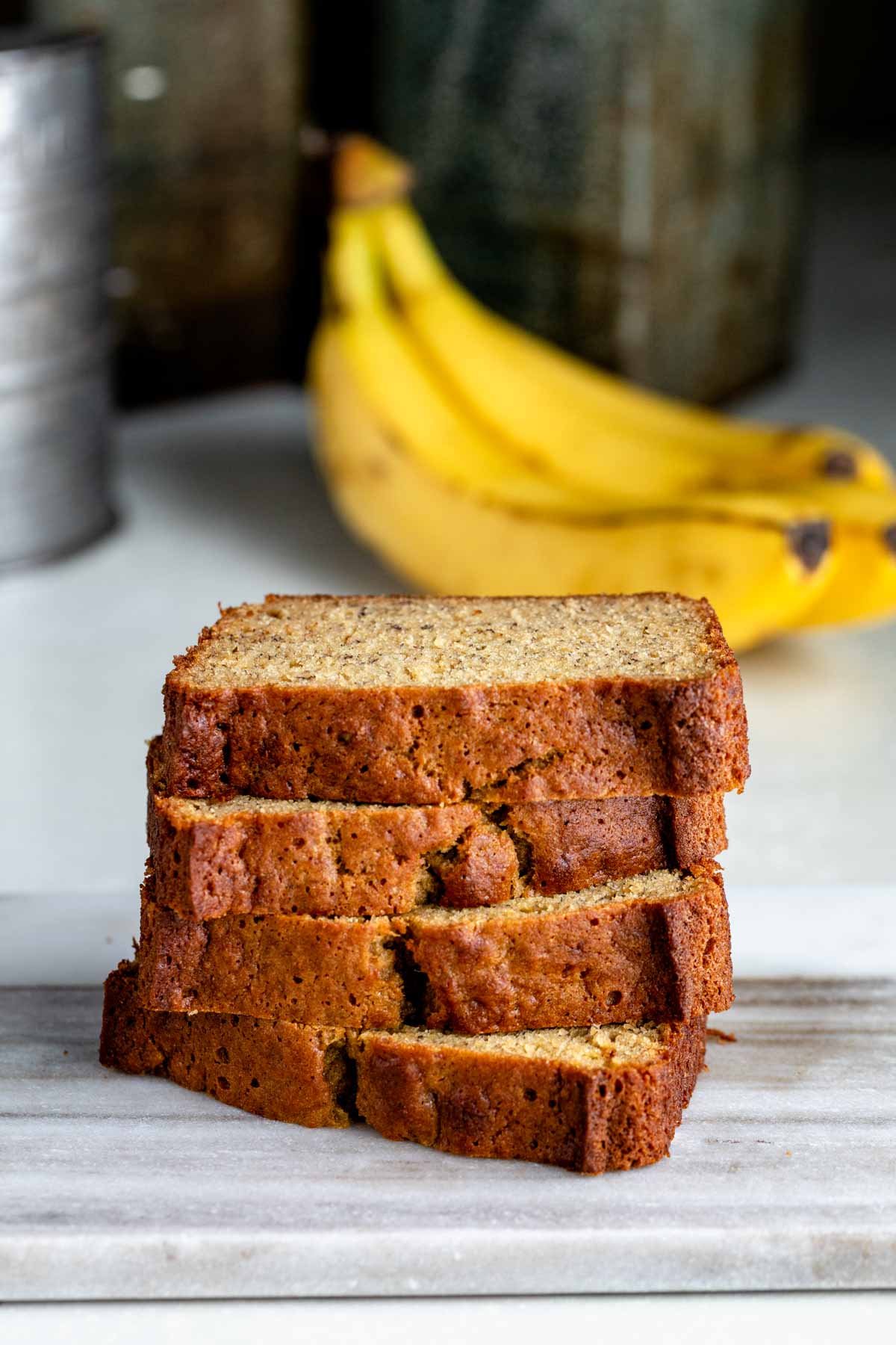 a stack of sliced whole wheat banana bread