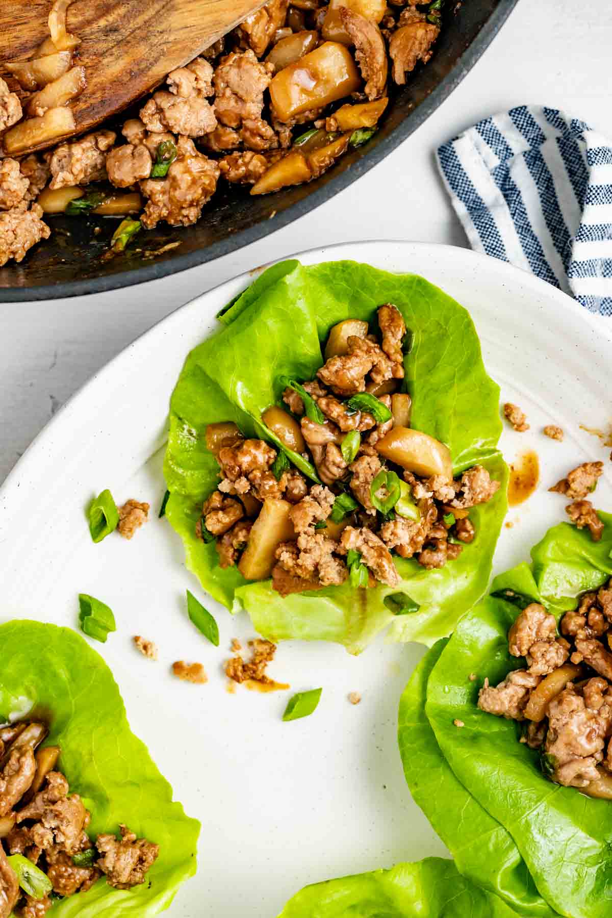 ground turkey lettuce wraps on a circular white plate