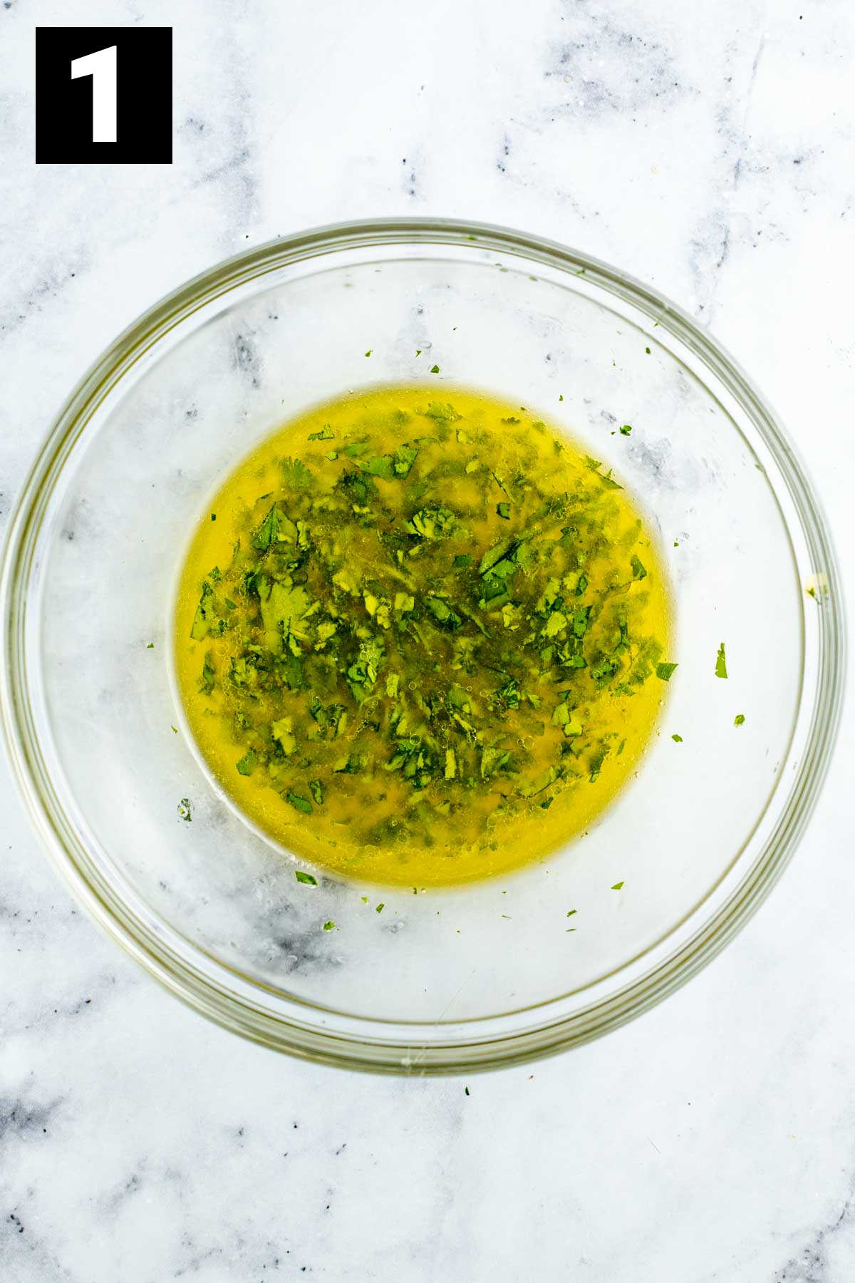 citrus dressing mixed in a clear bowl
