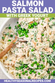 salmon pasta salad in a white bowl with text overlay