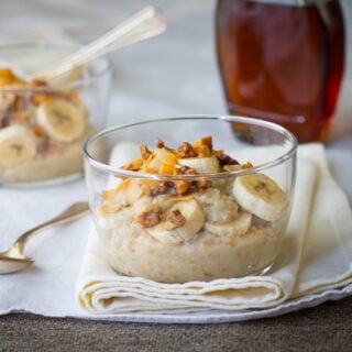 steel cut oats with bananas in a glass bowl