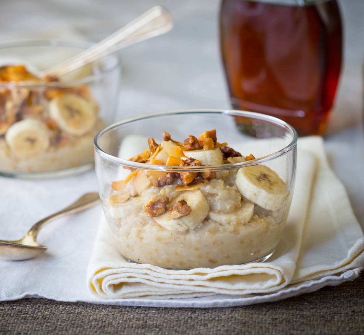 steel cut oats with bananas and walnuts in a glass bowl | healthy breakfast ideas