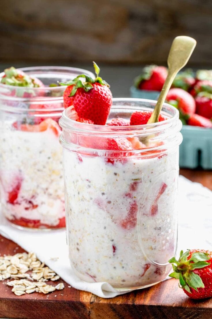 strawberry overnight oats with chia and flax seeks in mason jars