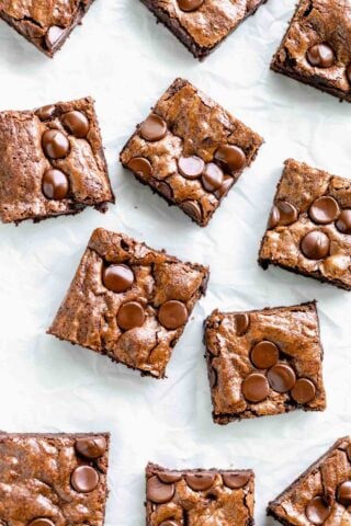 whole wheat brownies cut into squares on a white table