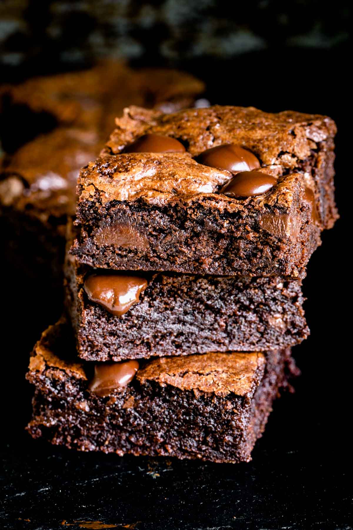 3 squares of whole wheat brownies stacked on top of each other