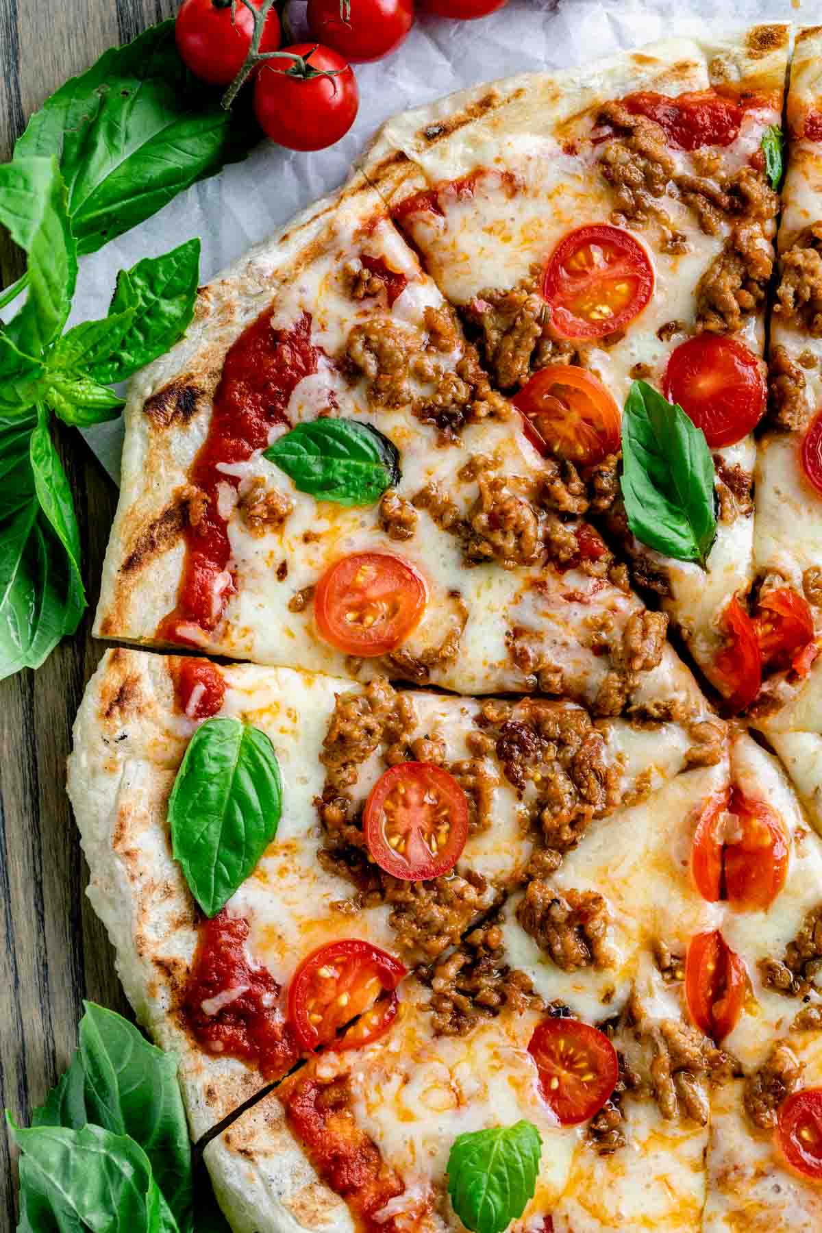 pizza on the grill sliced into triangle