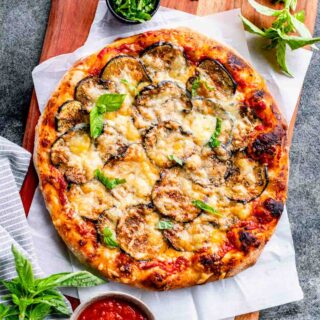 eggplant pizza on cutting board