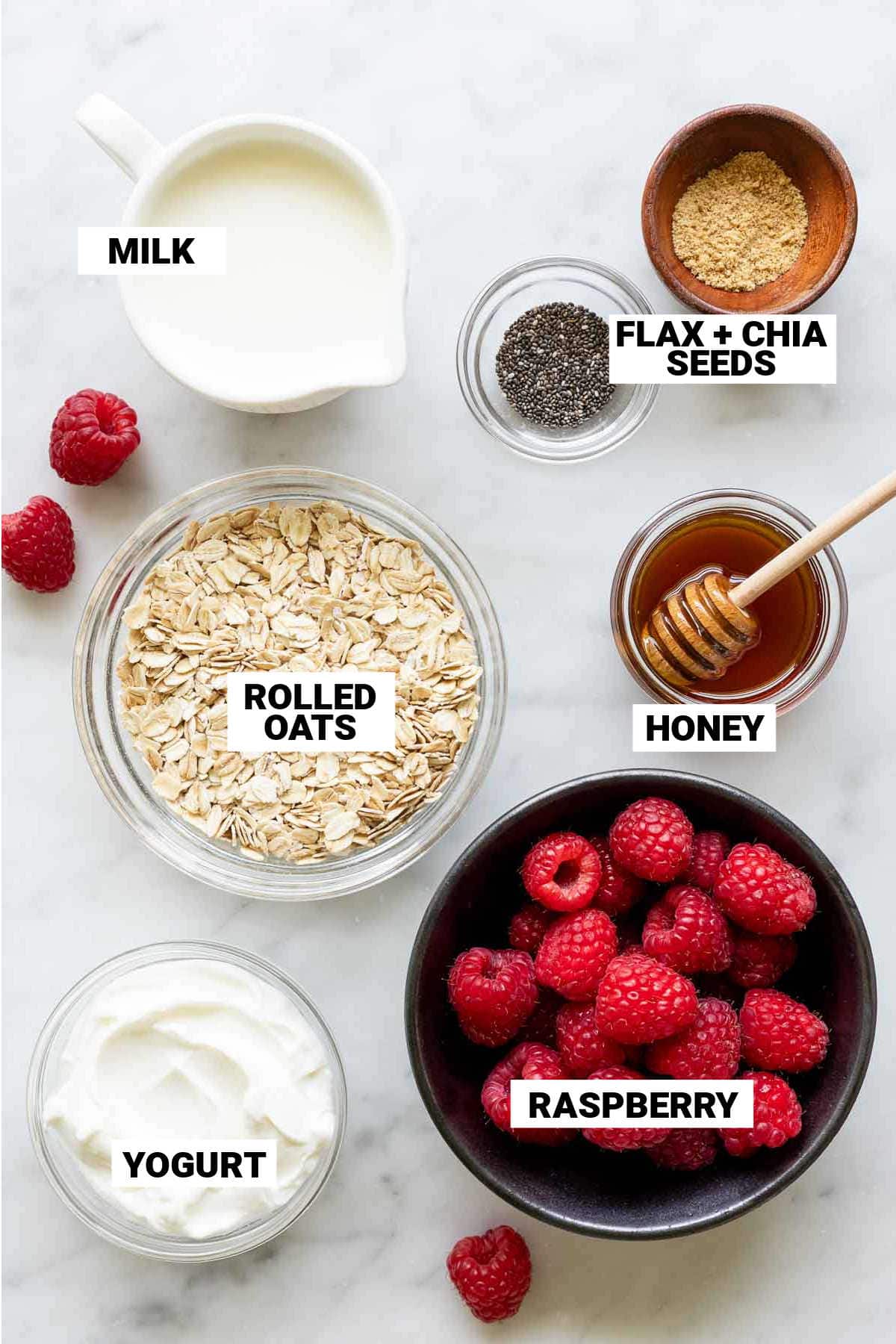 overnight oats with raspberry ingredients on counter with text overlay