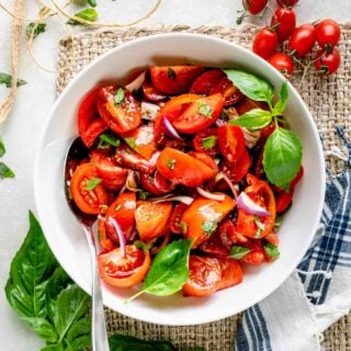 the tomato salad in a white bowl