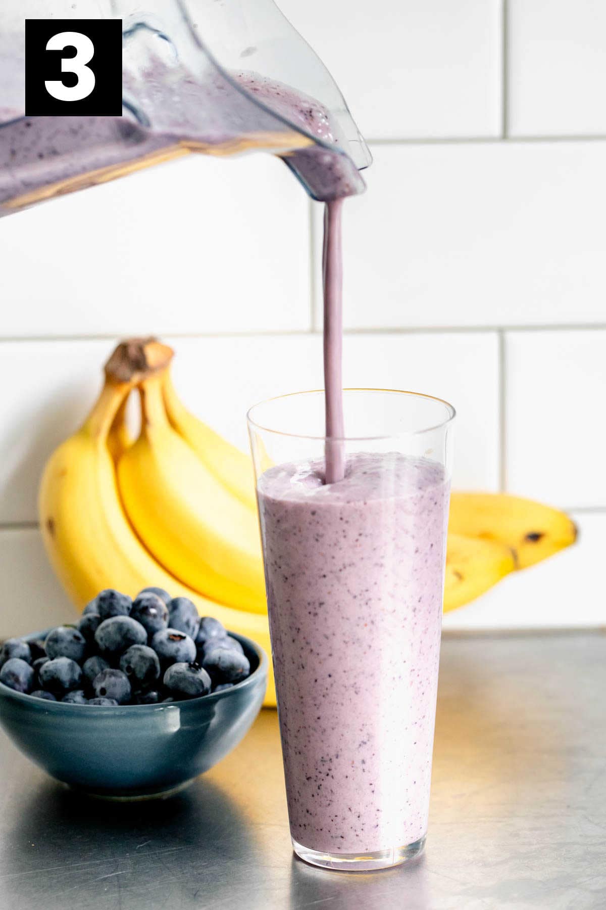 pour the smoothie into two glasses