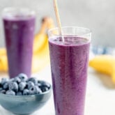 two glasses of blueberry banana smoothies