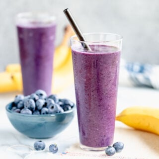 two glasses of blueberry banana smoothies