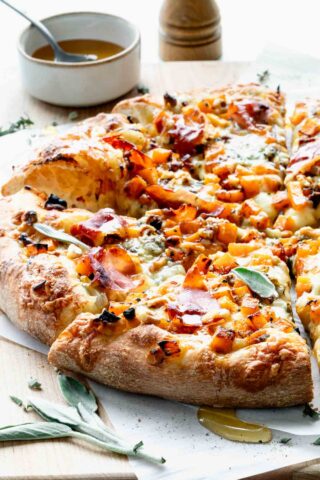 butternut squash pizza on cutting board