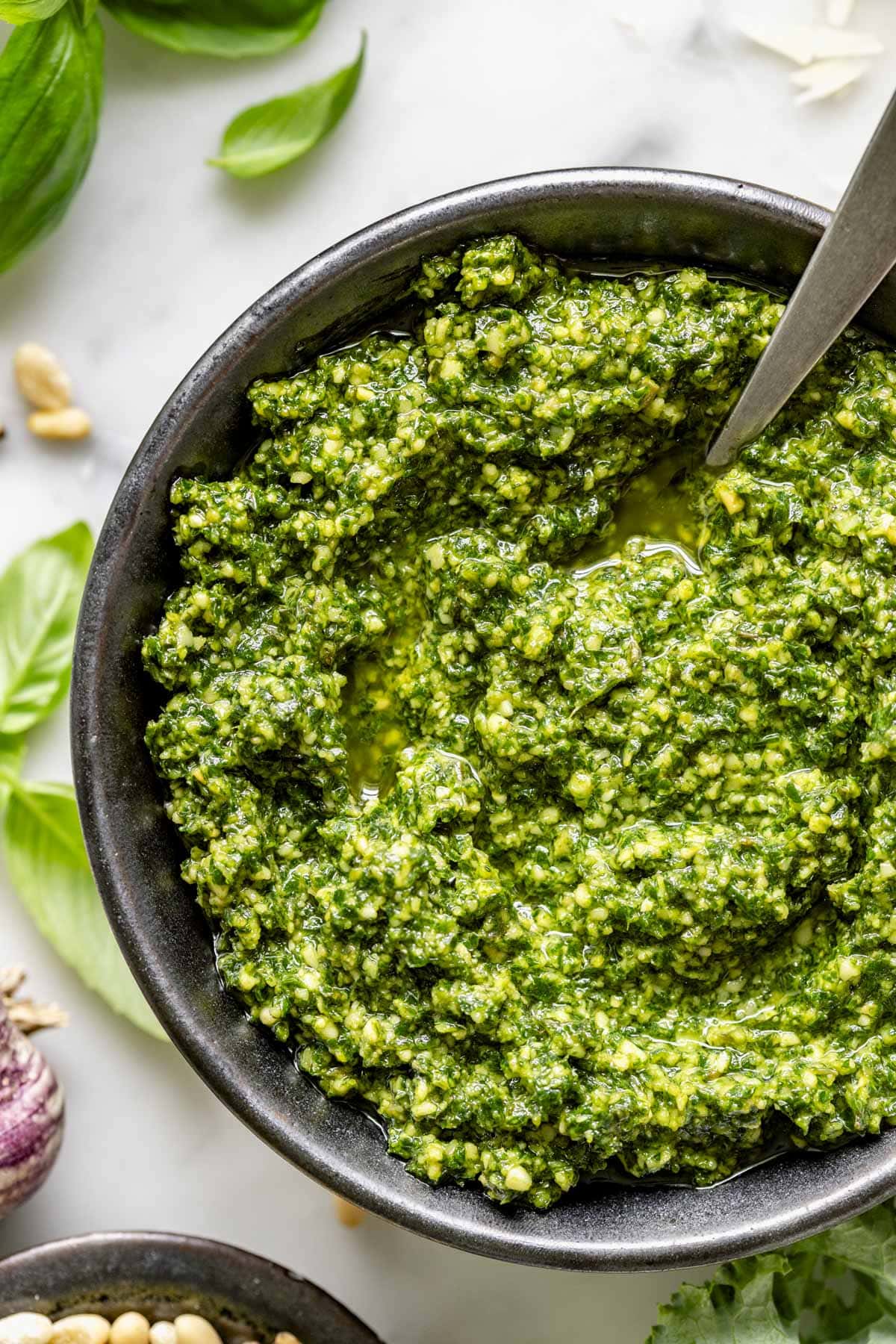 close up of the kale pesto in a black bowl