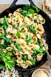 overhead photo of broccoli rabe with pasta in a skillet
