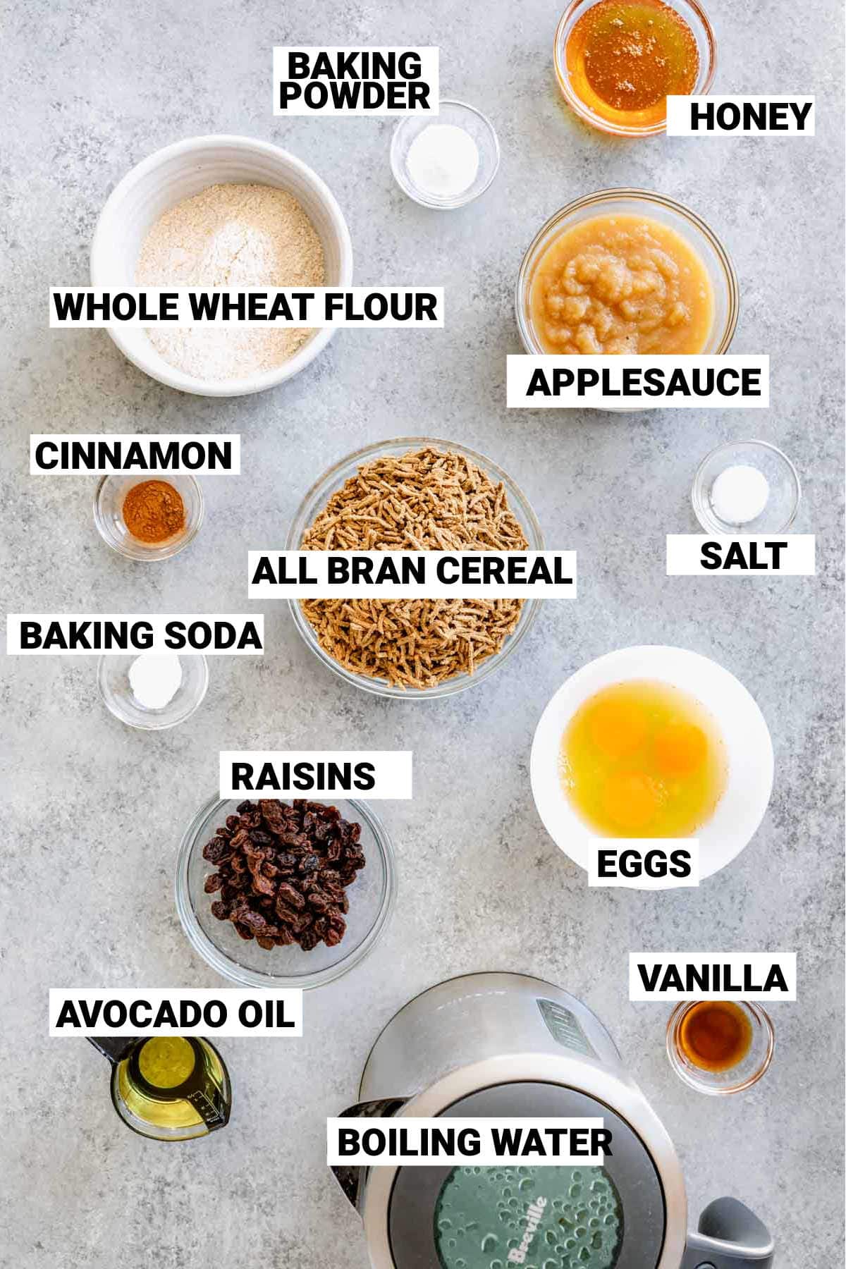 the bran muffin ingredients in bowls on a gray surface with text labels describing each one