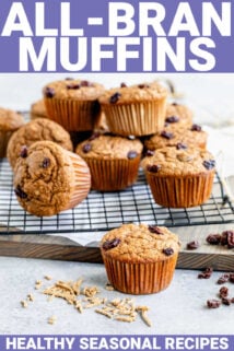 a batch of bran muffins on a cooling rack from the side in a white kitchen with oats on the counter