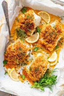 four pieces of pank cod in a parchment lined baking dish