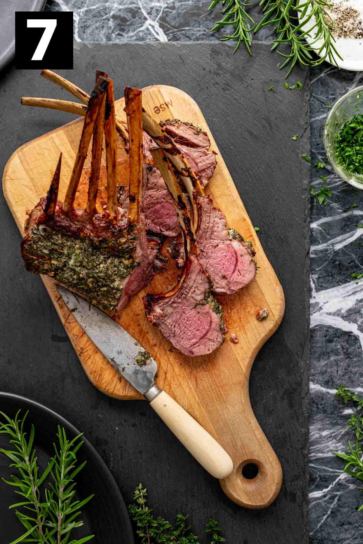 carving the lamb between the rib bones