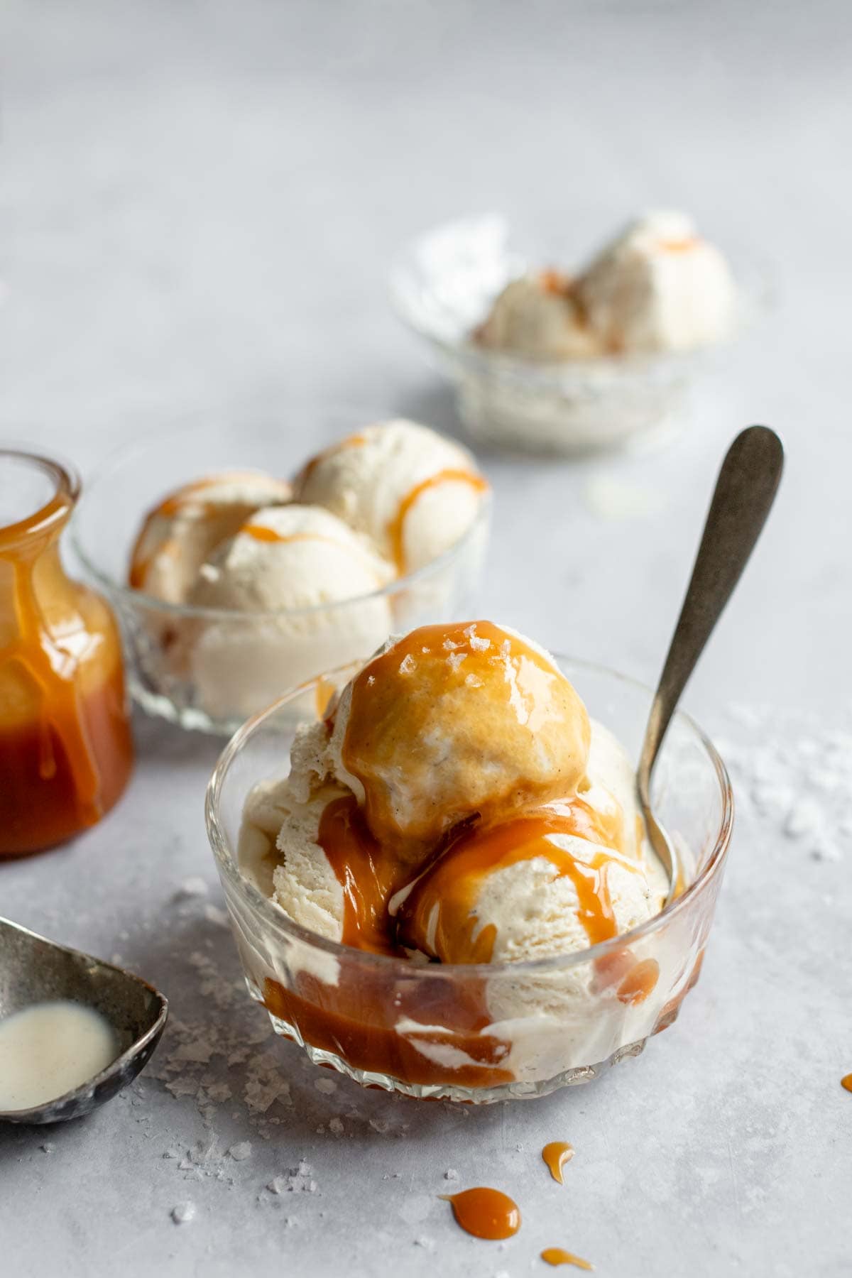 a bowl of ice cream with salted caramel sauce on top