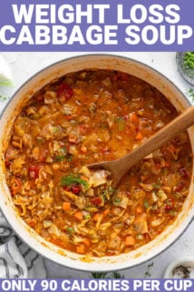 large dutch oven with low calorie cabbage soup and a wooden spoon in it with text overlay that reads weight loss cabbage soup
