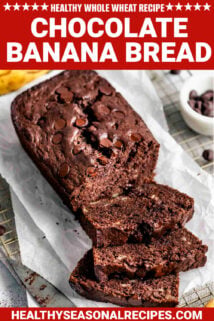 healthy whole wheat chocolate banana bread on a piece of parchment with text overlay
