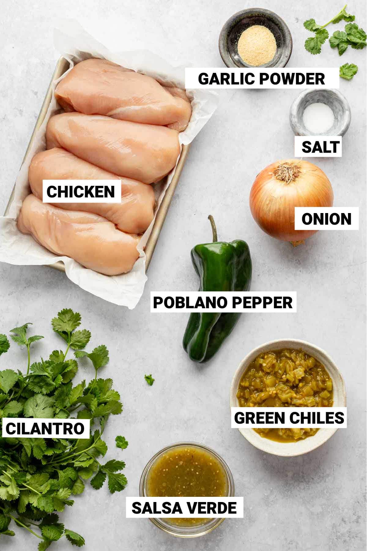 the ingredients for the chicken crockpot recipe on a white surface with text overlay