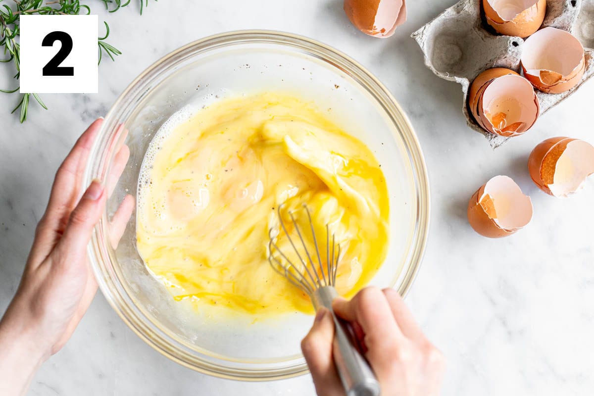 beating the eggs in a large bowl with the seasonings and milk