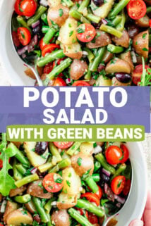 a close up of the potato salad with green beans in a white bowl from overhead