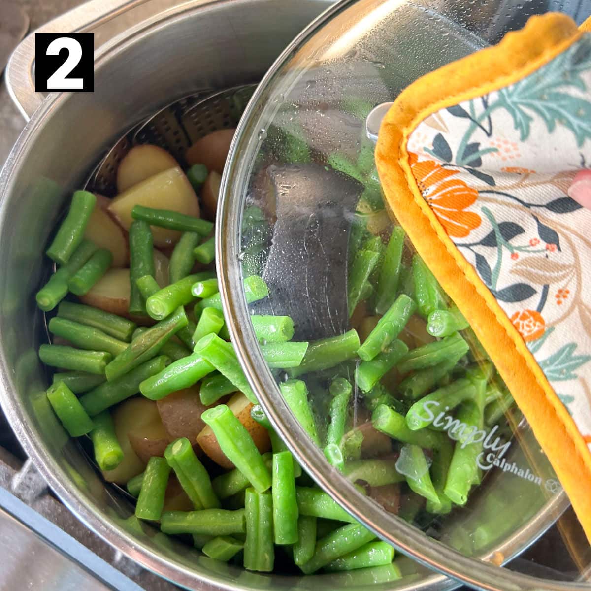 add the green beans on top and then place the lid back on to let them steam together for another 3 or 4 minutes