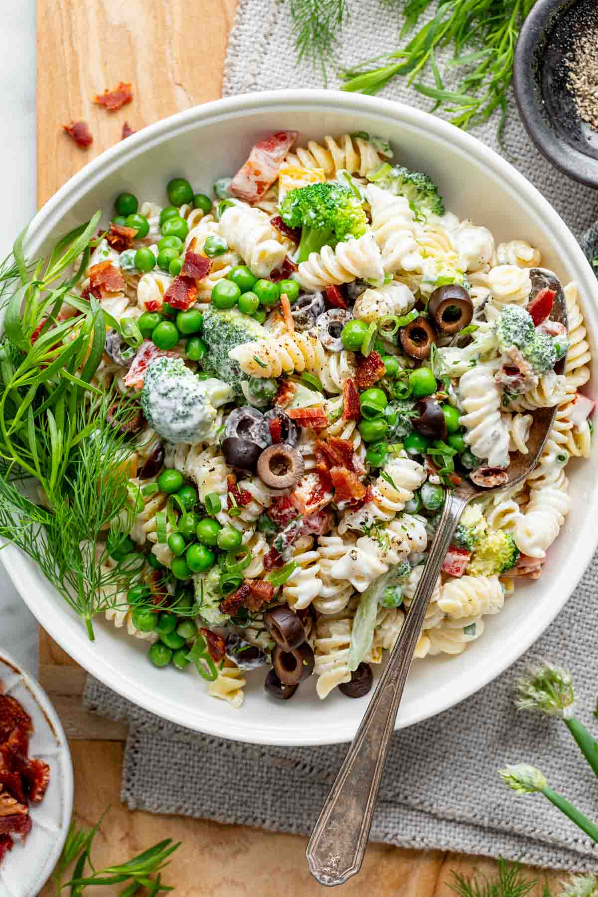 the healthy pasta salad in a white bowl
