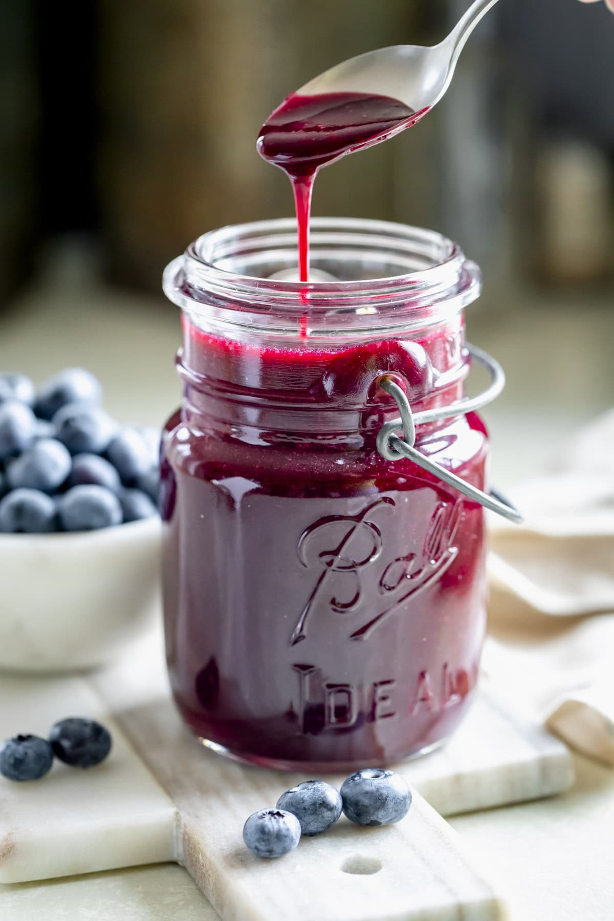 homemade blueberry sauce in mason jar