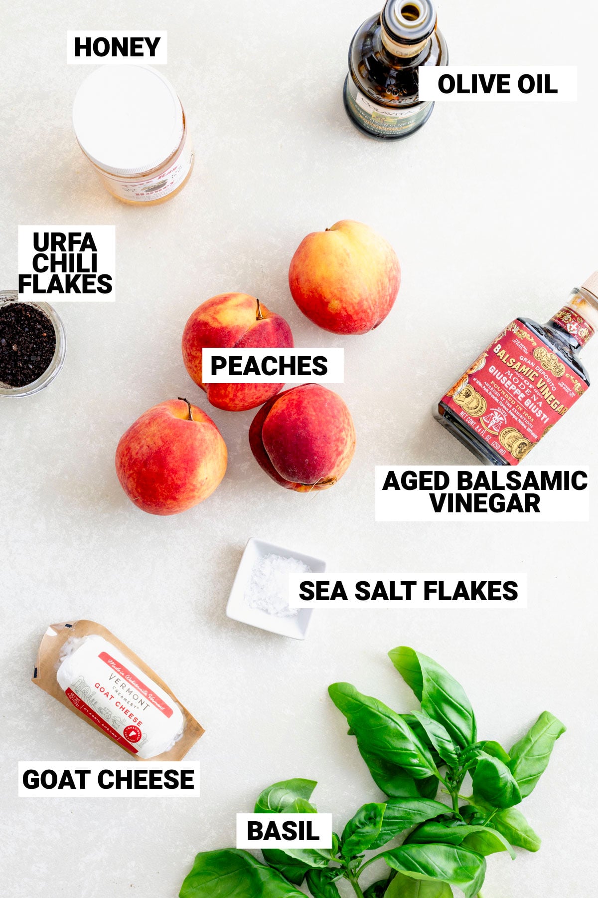 grilled peach salad ingredients on a white table with text overlay